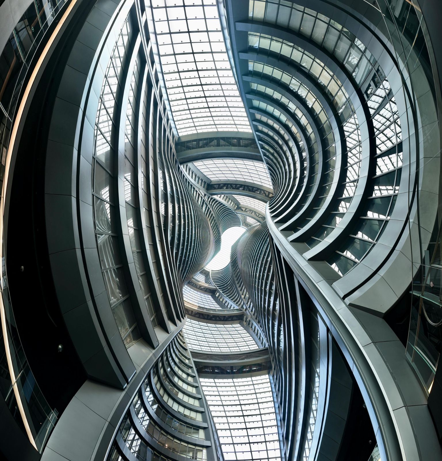 Futuristic architectural design with curved glass structures