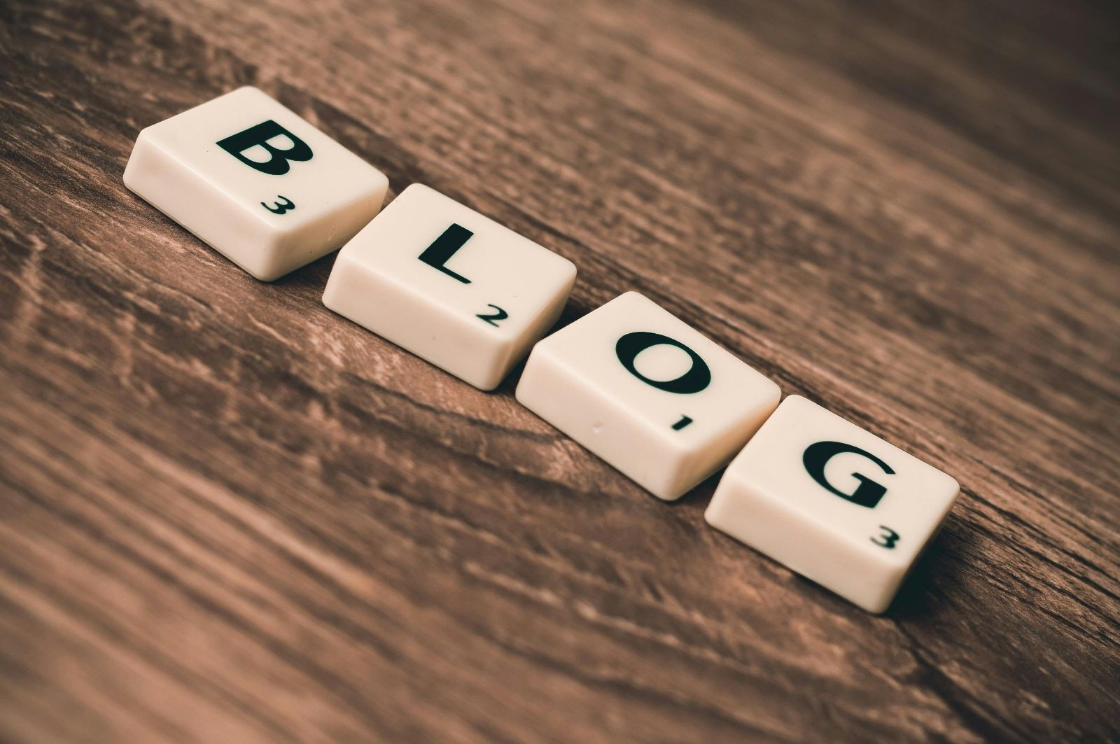 Blog tiles on wooden surface