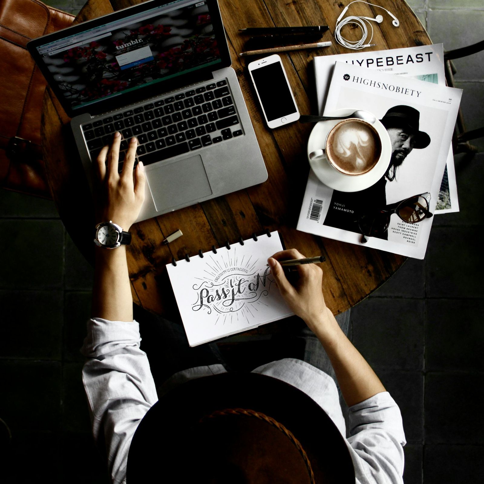 Designer working on art with laptop