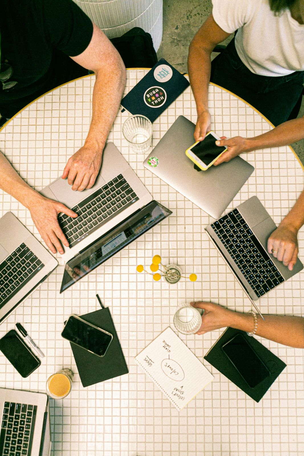 Teamwork meeting with laptops and smartphones